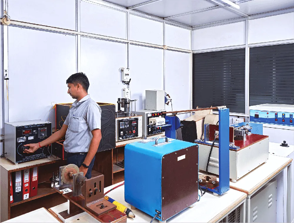 Ni-San Cords team member operating electrical test equipment in the company laboratory