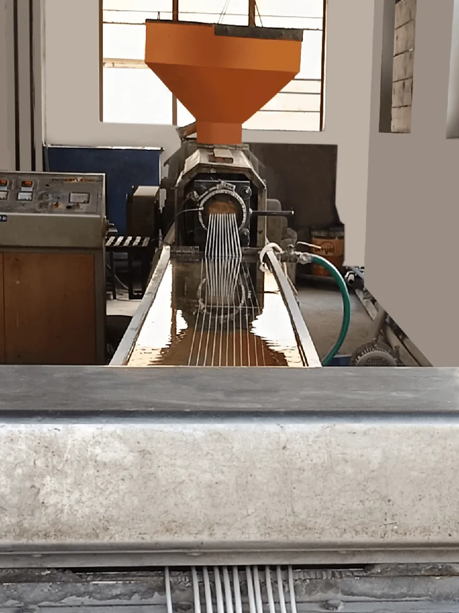 Cable extrusion strands exiting production equipment at a Ni-San Cords manufacturing facility